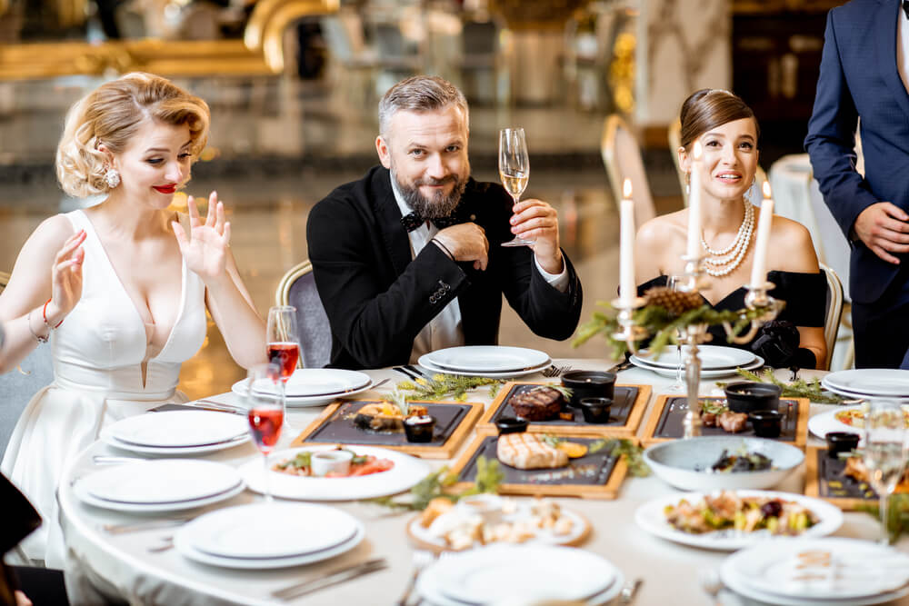 elegantly-dressed-people-having-a-festive-dinner-i-2026-01-09-06-45-46-utc.jpg